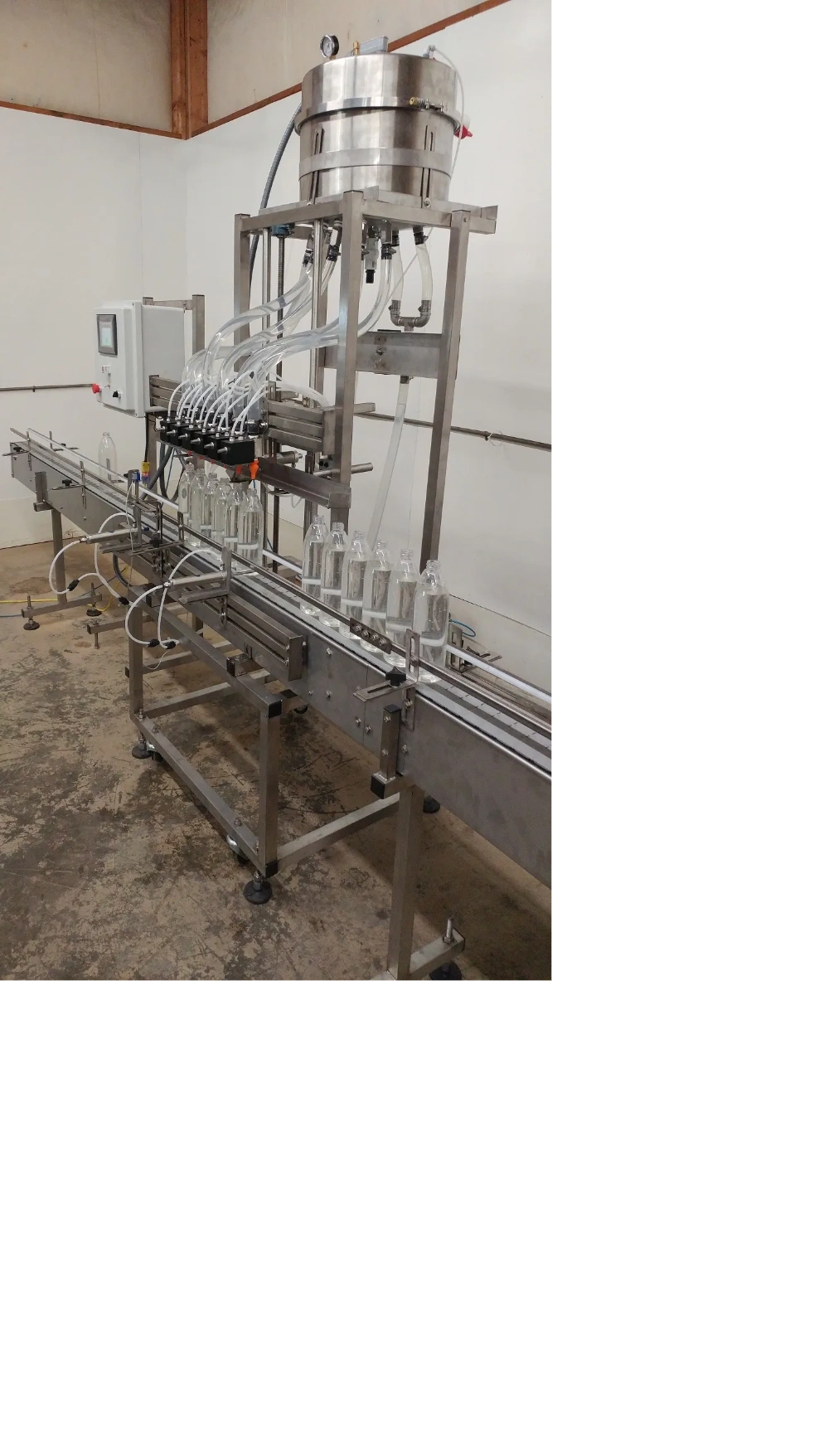 Liquid filling line conveyor bottles